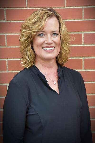 Kelly Hemrich smiling for the camera