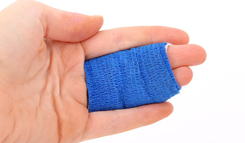a worker's fingers bandaged together