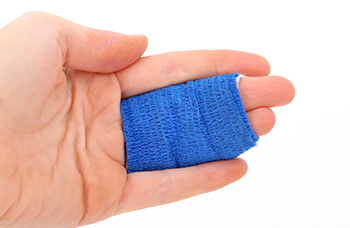 hand with 2 fingers bandaged together